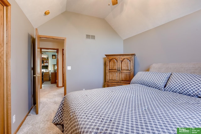 carpeted bedroom featuring lofted ceiling and ceiling fan