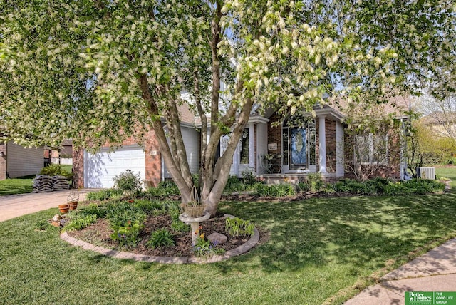 obstructed view of property featuring a front lawn and a garage