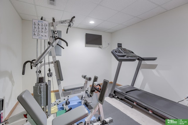 exercise area with a paneled ceiling