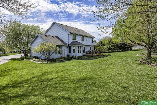 view of front of property featuring a front lawn and cooling unit