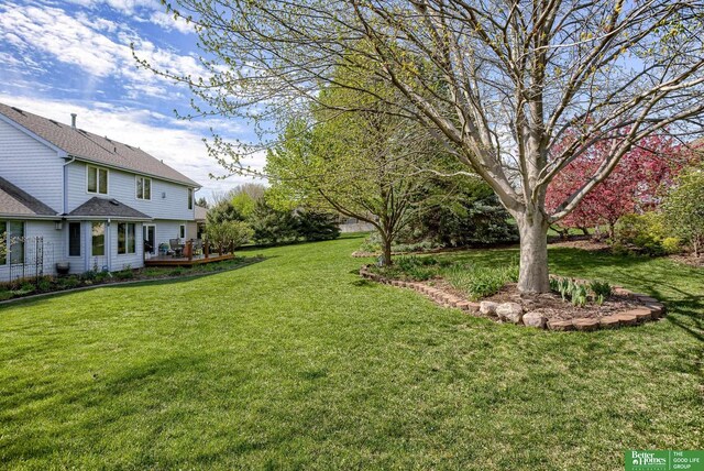 view of yard featuring a wooden deck