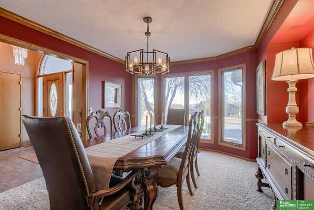 carpeted dining space with a chandelier and crown molding