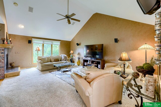 carpeted living room with high vaulted ceiling, ceiling fan, and a fireplace