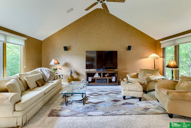 living room with high vaulted ceiling, a wealth of natural light, and ceiling fan