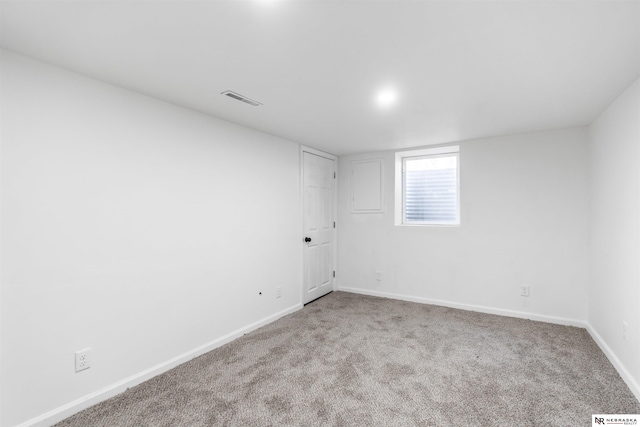 spare room with light carpet