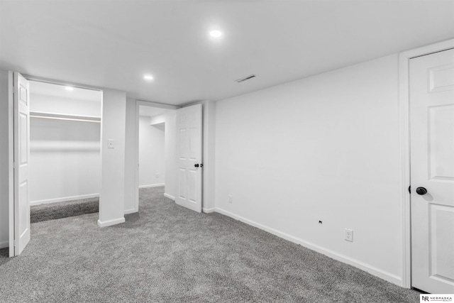 unfurnished bedroom featuring a closet and carpet floors