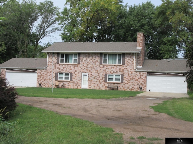 view of front of home featuring a garage and a front yard