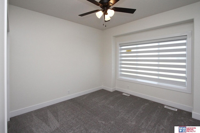 carpeted empty room featuring ceiling fan