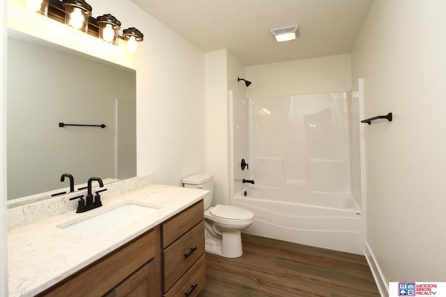 full bathroom featuring wood-type flooring, vanity, toilet, and shower / bath combination