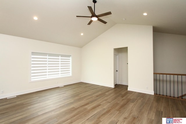 unfurnished room with high vaulted ceiling, hardwood / wood-style flooring, and ceiling fan