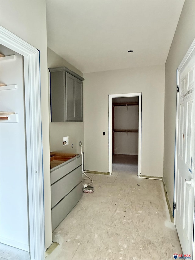 interior space with washer hookup and cabinets