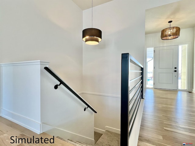 stairs featuring wood-type flooring