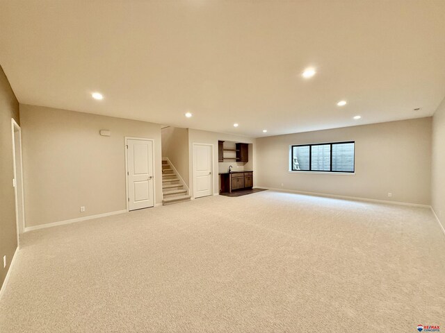 basement with light colored carpet