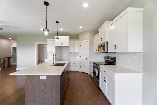 216 St Andrews Loop, Malvern, IA 51551 - kitchen with appliances with stainless steel finishes, a sink, recessed lighting, backsplash, and dark wood finished floors