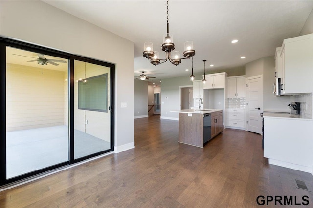 216 St Andrews Loop, Malvern, IA 51551 - kitchen featuring a ceiling fan, dishwasher, a chandelier, white cabinetry, and a center island with sink