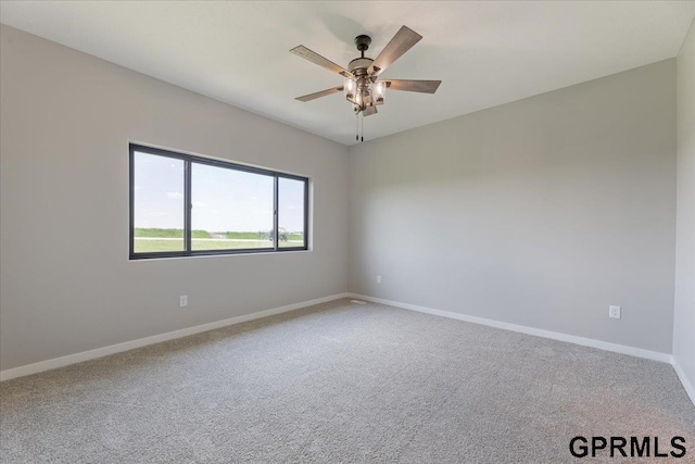 216 St Andrews Loop, Malvern, IA 51551 - unfurnished room featuring carpet floors, ceiling fan, and baseboards