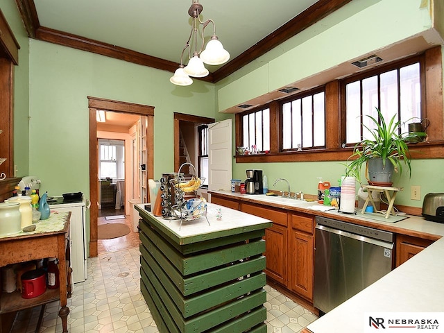 kitchen featuring dishwasher, plenty of natural light, decorative light fixtures, and crown molding