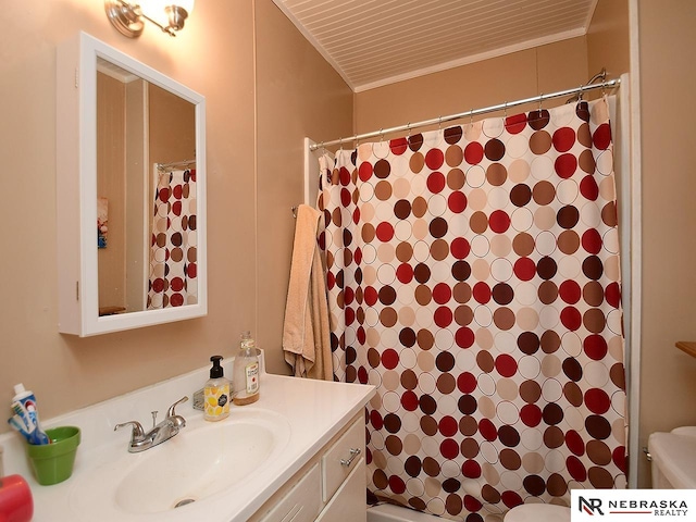 bathroom featuring walk in shower, vanity, and toilet