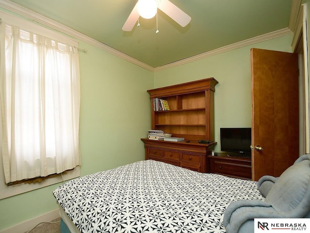 bedroom with ceiling fan, carpet flooring, and crown molding