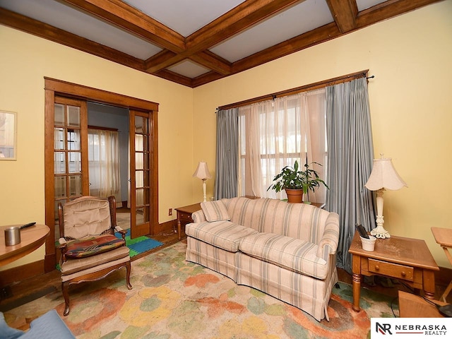 carpeted living room with french doors, beamed ceiling, and coffered ceiling