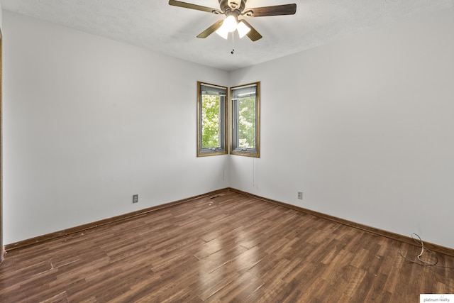 2119 N 144th Ave, Omaha, NE 68116 - unfurnished room featuring wood finished floors, ceiling fan, baseboards, and a textured ceiling