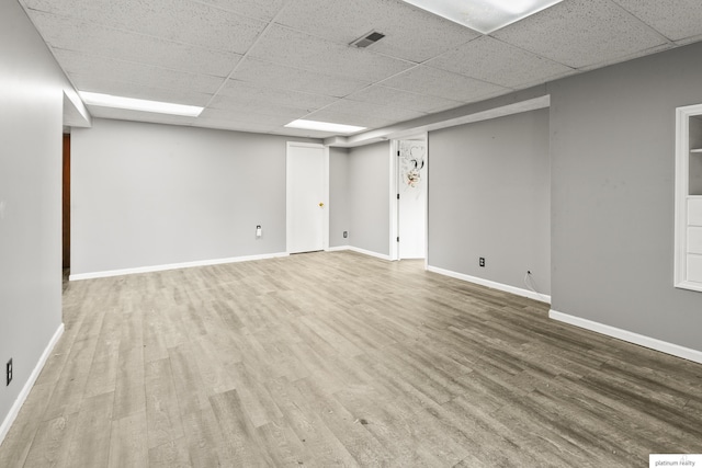2119 N 144th Ave, Omaha, NE 68116 - finished basement featuring a paneled ceiling, wood finished floors, and baseboards