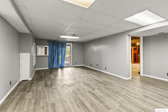 2119 N 144th Ave, Omaha, NE 68116 - empty room with a paneled ceiling, wood finished floors, and baseboards