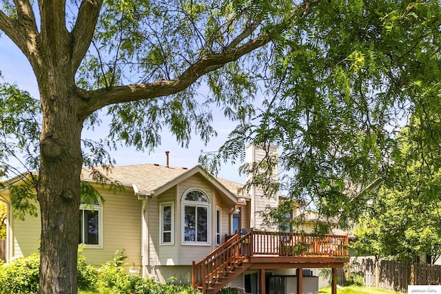 2119 N 144th Ave, Omaha, NE 68116 - back of property featuring a wooden deck, stairway, and a chimney