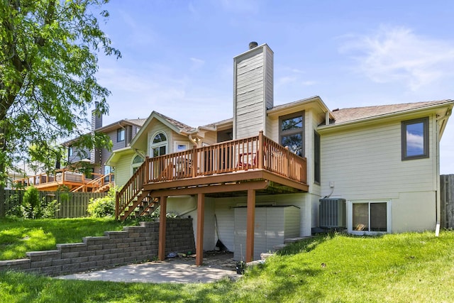 2119 N 144th Ave, Omaha, NE 68116 - back of property with a chimney, a wooden deck, central AC, and a patio