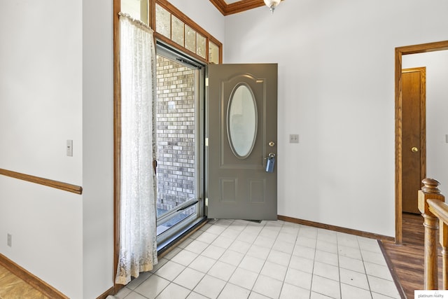 2119 N 144th Ave, Omaha, NE 68116 - foyer entrance with baseboards, crown molding, and light tile patterned flooring