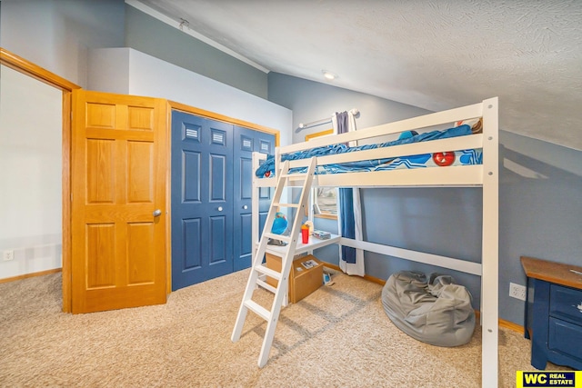 bedroom with light colored carpet, a textured ceiling, vaulted ceiling, and a closet