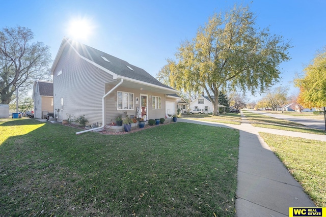 view of home's exterior with a garage and a yard