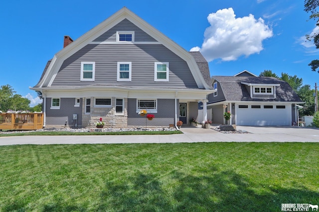 view of front of property with a front yard and a deck