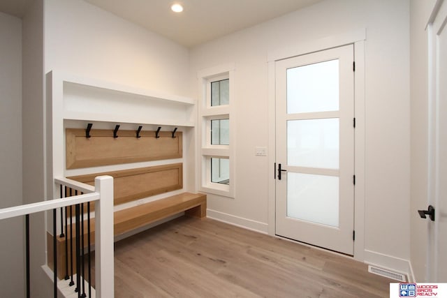 mudroom with light hardwood / wood-style flooring