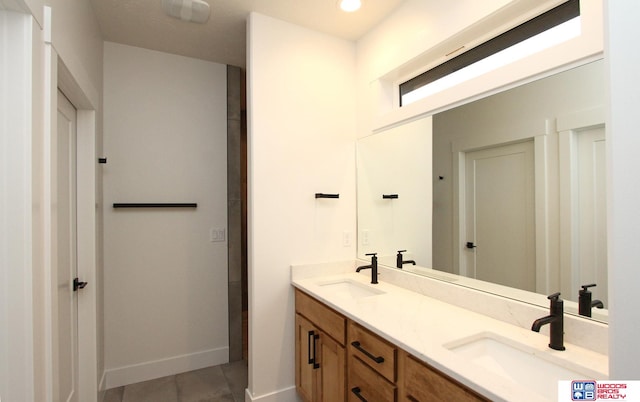 bathroom featuring vanity and tile patterned flooring