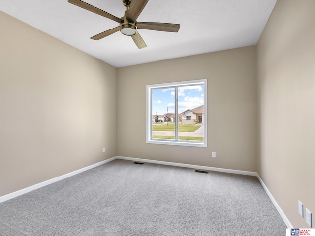 unfurnished room featuring ceiling fan and carpet floors