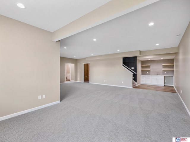 unfurnished living room with carpet floors