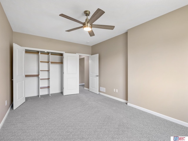 unfurnished bedroom featuring ceiling fan, carpet flooring, and a closet