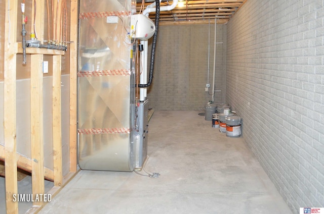 basement featuring heating unit and brick wall