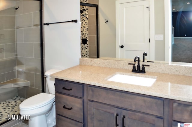 bathroom with a shower with door, vanity, and toilet