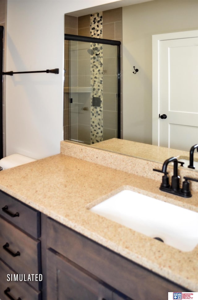 bathroom with vanity and an enclosed shower