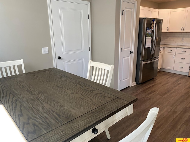 dining space featuring dark hardwood / wood-style flooring