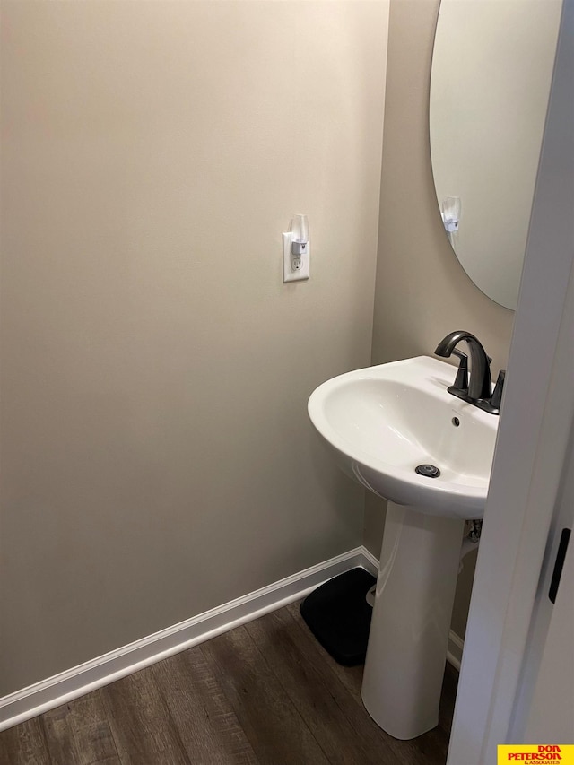 bathroom with hardwood / wood-style flooring