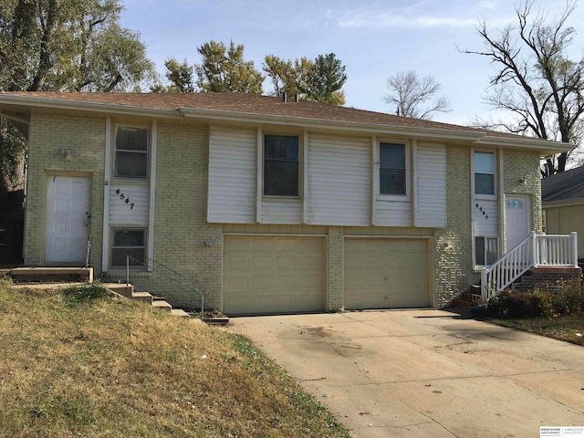 raised ranch featuring a garage