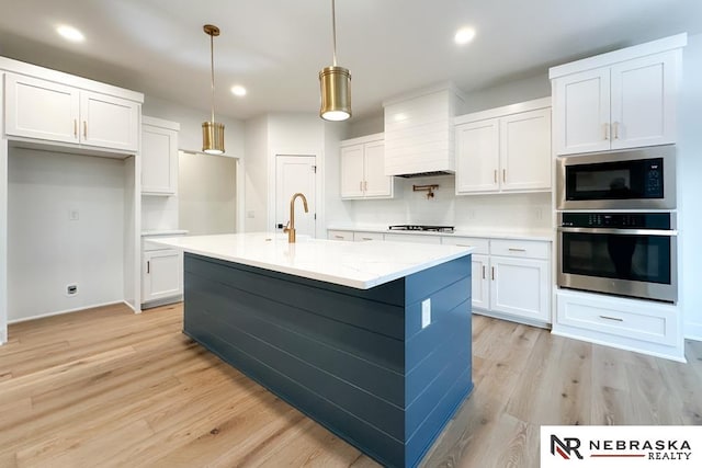 kitchen with white cabinetry and stainless steel appliances