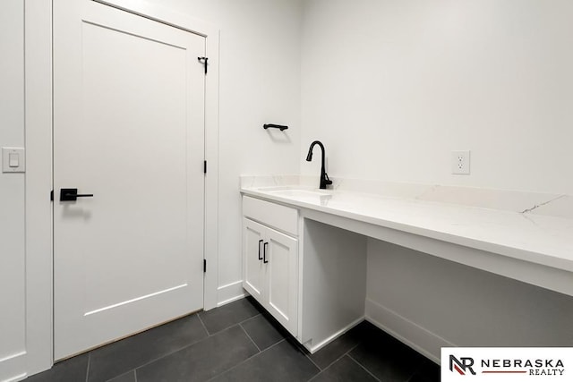 bathroom featuring tile patterned flooring and vanity