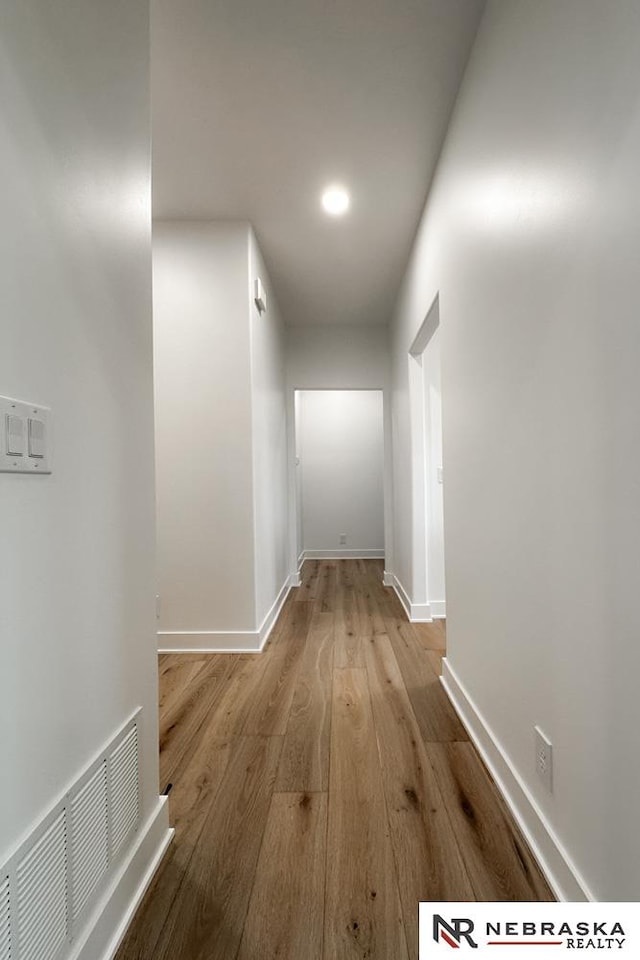 corridor featuring light hardwood / wood-style flooring