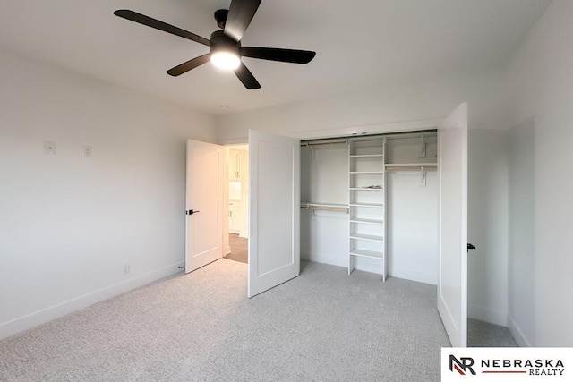 unfurnished bedroom featuring a closet, ceiling fan, and light carpet