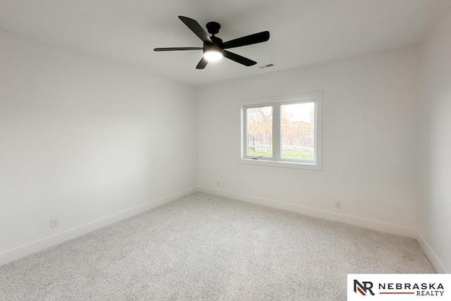 carpeted empty room featuring ceiling fan