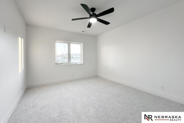 spare room featuring carpet flooring and ceiling fan